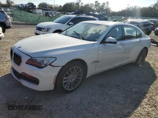 2014 BMW 7 Series 740Li xDrive with VIN WBAYF4C58ED281977, listed as a Copart auction lot 44084005 with 154,592 mi miles and Clean Title. Bid and sale history available at carsss.com. Image 1.