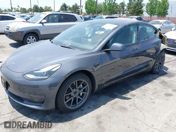 2023 Tesla Model 3 with VIN 5YJ3E1EA4PF400306, listed as a IAAI auction lot 42398603 with 18,551 mi miles and . Bid and sale history available at DreamBid. Image 2.