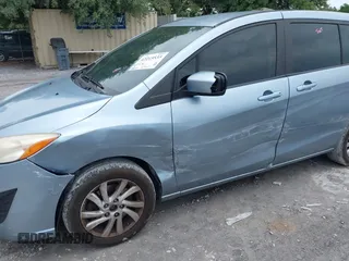 2012 Mazda 5 Sport with VIN JM1CW2BL4C0130446, listed as a IAAI auction lot 42215533 with 238,221 mi miles and . Bid and sale history available at DreamBid. Image 6.