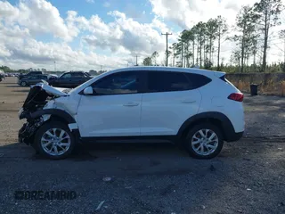 2019 Hyundai Tucson SE with VIN KM8J2CA48KU951829, listed as a IAAI auction lot 41261166 with 100,533 mi miles. Bid and sale history available at carsss.com. Image 14.