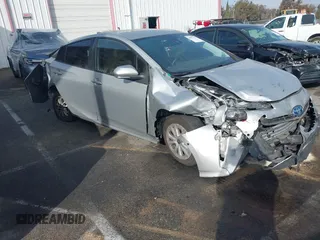 2021 Toyota Prius L Eco with VIN JTDKAMFU8M3135514, listed as a IAAI auction lot 40977114 with 70,451 mi miles. Bid and sale history available at carsss.com. Image 1.