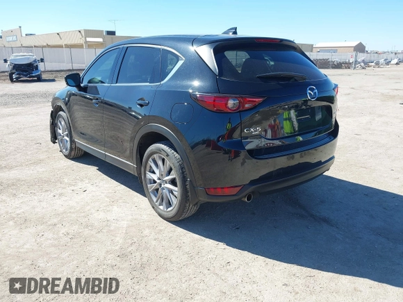 2020 Mazda CX-5 Grand Touring with VIN JM3KFBDMXL0763316, listed as a IAAI auction lot 41661958 with 64,881 mi miles and . Bid and sale history available at carsss.com. Image 3.