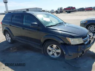 2012 Dodge Journey SXT z VIN 3C4PDDBG0CT249314, wystawiony jako IAAI lot #41877763 z przebiegiem 196 787 mil mil oraz . Historia ofert i sprzedaży dostępna na DreamBid. Obrazek 1.