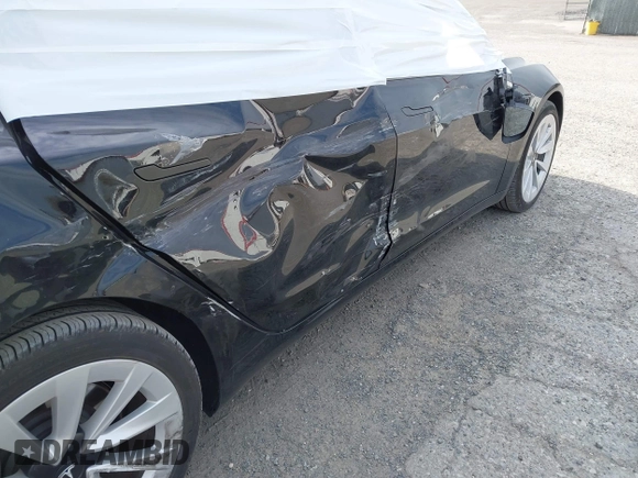 2022 Tesla Model 3 Long Range with VIN 5YJ3E1EB6NF343869, listed as a IAAI auction lot 41826077 with 36,643 mi miles and . Bid and sale history available at DreamBid. Image 6.
