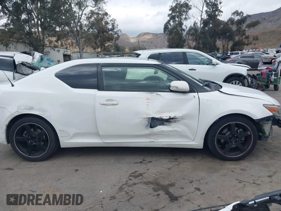 2014 Scion tC with VIN JTKJF5C79E3075707, listed as a IAAI auction lot 41557310 with 132,468 mi miles. Bid and sale history available at carsss.com. Image 14.