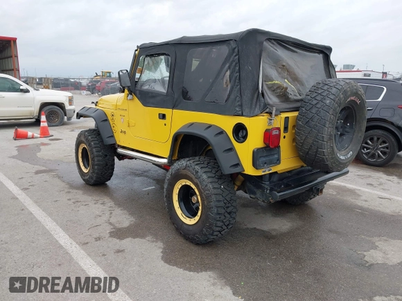 2000 Jeep Wrangler SE with VIN 1J4FA29P5YP705215, listed as a IAAI auction lot 41920532 with 92,927 mi miles and . Bid and sale history available at DreamBid. Image 3.