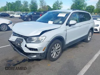 2018 Volkswagen Tiguan S with VIN 3VV0B7AX5JM025815, listed as a IAAI auction lot 42219906 with 168,122 mi miles and . Bid and sale history available at DreamBid. Image 2.