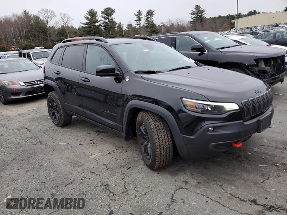 2022 Jeep Cherokee Trailhawk with VIN 1C4PJMBX3ND502322, listed as a Copart auction lot 85561444 with 57,630 mi miles and Salvage Title. Bid and sale history available at carsss.com. Image 4.
