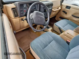 2000 Jeep Wrangler Sahara with VIN 1J4FA59S1YP777549, listed as a Copart auction lot 63622335 with 197,426 mi miles and Clean title. Bid and sale history available at DreamBid. Image 8.