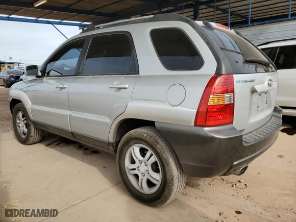 2006 Kia Sportage LX with VIN KNDJF723567206000, listed as a Copart auction lot 82759174 with 130,588 mi miles and Salvage Title. Bid and sale history available at carsss.com. Image 2.