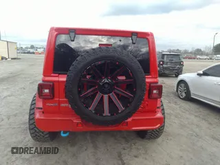 2022 Jeep Wrangler Unlimited Sahara with VIN 1C4JJXP62NW136932, listed as a IAAI auction lot 41486025 with 36,986 mi miles and . Bid and sale history available at DreamBid. Image 17.