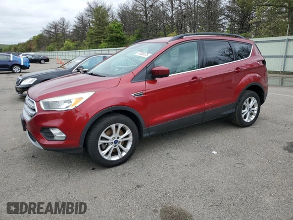 2018 Ford Escape SE z VIN 1FMCU9GD7JUB01668, wystawiony jako Copart lot #57038675 z przebiegiem 70 780 mil mil oraz Szkoda całkowita • Salvage title. Historia ofert i sprzedaży dostępna na DreamBid. Obrazek 1.