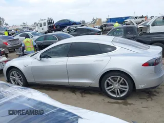 2013 Tesla Model S with VIN 5YJSA1DG7DFP11382, listed as a IAAI auction lot 42056169 with 126,975 mi miles. Bid and sale history available at carsss.com. Image 14.
