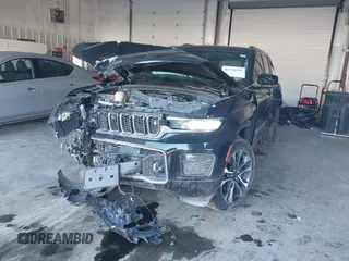 2023 Jeep Grand Cherokee Overland with VIN 1C4RJHDG5PC507978, listed as a IAAI auction lot 41394199 with 57,323 mi miles and . Bid and sale history available at DreamBid. Image 2.