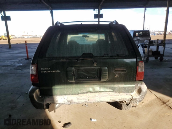 2002 Isuzu Rodeo z VIN 4S2CK58DX24320793, wystawiony jako Copart lot #46357065 z przebiegiem 180 306 mil mil oraz Szkody całkowita. Historia ofert i sprzedaży dostępna na DreamBid. Obrazek 6.