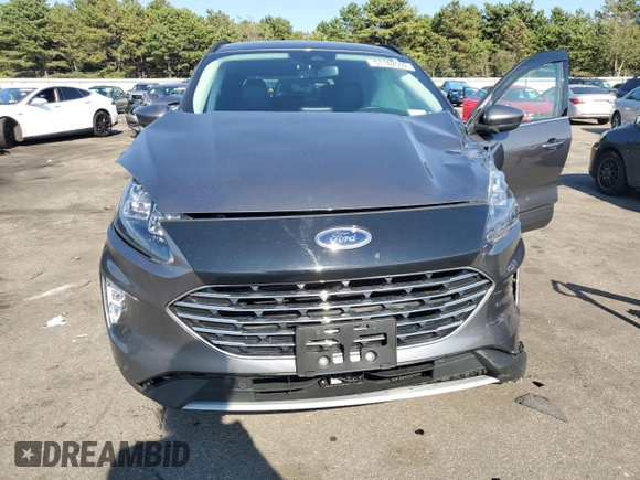 2021 Ford Escape Titanium Plug-In Hybrid z VIN 1FMCU0LZ1MUB17737, wystawiony jako Copart lot #57162592 z przebiegiem Nie podano mil oraz . Historia ofert i sprzedaży dostępna na DreamBid. Obrazek 7.