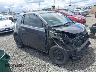 2012 Scion iQ z VIN JTNJJXB00CJ018659, wystawiony jako IAAI lot #42232715 z przebiegiem 142 516 mil mil oraz . Historia ofert i sprzedaży dostępna na DreamBid. Obrazek 1.