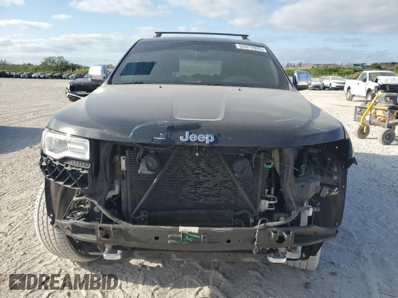 2015 Jeep Grand Cherokee Overland with VIN 1C4RJFCG6FC919637, listed as a Copart auction lot 52072925 with 111,552 mi miles and Salvage Title. Bid and sale history available at carsss.com. Image 5.