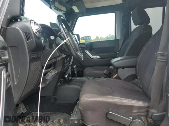 2013 Jeep Wrangler Unlimited Rubicon with VIN 1C4BJWFG5DL661282, listed as a Copart auction lot 57471035 with 128,400 mi miles and Salvage title. Bid and sale history available at DreamBid. Image 7.