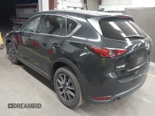 2018 Mazda CX-5 Grand Touring z VIN JM3KFADMXJ0311101, wystawiony jako IAAI lot #42163070 z przebiegiem 129 284 mil mil oraz . Historia ofert i sprzedaży dostępna na DreamBid. Obrazek 3.