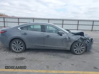 2020 Mazda 6 Grand Touring with VIN JM1GL1TY6L1525169, listed as a IAAI auction lot 41683512 with 73,313 mi miles and . Bid and sale history available at DreamBid. Image 13.