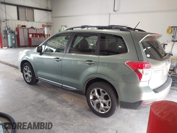 2015 Subaru Forester Touring with VIN JF2SJAUC5FH518262, listed as a IAAI auction lot 42789542 with 182,869 mi miles and . Bid and sale history available at DreamBid. Image 3.
