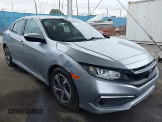 2020 Honda Civic LX z VIN 19XFC2F66LE203429, wystawiony jako IAAI lot #41901641 z przebiegiem 63 162 mil mil oraz . Historia ofert i sprzedaży dostępna na DreamBid. Obrazek 1.