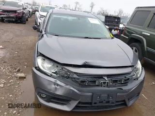 2017 Honda Civic EX-T with VIN 19XFC1F34HE014334, listed as a IAAI auction lot 42009311 with 124,717 mi miles. Bid and sale history available at carsss.com. Image 12.