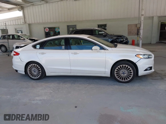 2016 Ford Fusion Titanium with VIN 3FA6P0K96GR390989, listed as a IAAI auction lot 42634275 with 123,559 mi miles and . Bid and sale history available at DreamBid. Image 13.