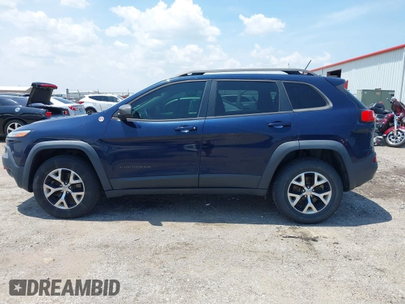 2015 Jeep Cherokee Trailhawk with VIN 1C4PJMBS3FW704622, listed as a IAAI auction lot 42465702 with 96,831 mi miles and . Bid and sale history available at DreamBid. Image 14.