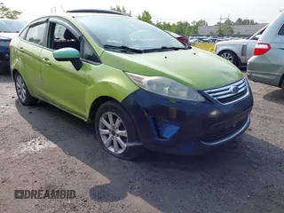 2011 Ford Fiesta SE z VIN 3FADP4BJ7BM122774, wystawiony jako IAAI lot #42392327 z przebiegiem 174 764 mil mil oraz . Historia ofert i sprzedaży dostępna na DreamBid. Obrazek 1.