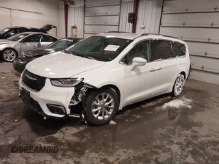 2021 Chrysler Pacifica Touring L with VIN 2C4RC1BG3MR504293, listed as a IAAI auction lot 41728608 with 70,487 mi miles and . Bid and sale history available at DreamBid. Image 21.