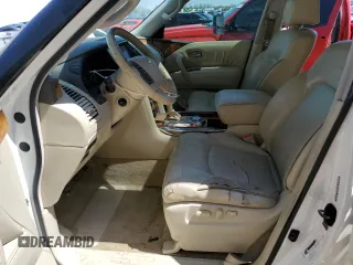 2012 Infiniti QX56 8-passenger with VIN JN8AZ2NDXC9715034, listed as a Copart auction lot 52148395 with 227,943 mi miles and Salvage title. Bid and sale history available at DreamBid. Image 7.