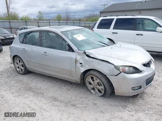2009 Mazda Mazda3 s Touring with VIN JM1BK344991199798, listed as a IAAI auction lot 42038827 with 159,407 mi miles. Bid and sale history available at carsss.com. Image 1.