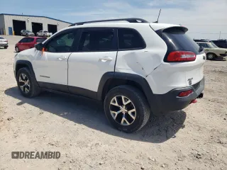 2016 Jeep Cherokee Trailhawk with VIN 1C4PJMBS3GW102000, listed as a Copart auction lot 60866505 with 120,985 mi miles and Salvage title. Bid and sale history available at DreamBid. Image 2.
