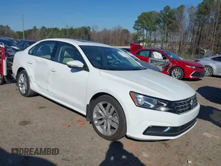 2019 Volkswagen Passat 2.0T Wolfsburg Edition with VIN 1VWLA7A32KC000818, listed as a IAAI auction lot 41711518 with 87,873 mi miles. Bid and sale history available at carsss.com. Image 1.