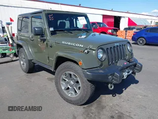2015 Jeep Wrangler Rubicon Hard Rock z VIN 1C4BJWCGXFL771669, wystawiony jako IAAI lot #42057423 z przebiegiem 36 996 mil mil oraz . Historia ofert i sprzedaży dostępna na DreamBid. Obrazek 1.