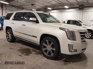 2015 Cadillac Escalade Premium z VIN 1GYS4CKJ8FR208128, wystawiony jako IAAI lot #41908785 z przebiegiem 164 598 mil mil oraz . Historia ofert i sprzedaży dostępna na DreamBid. Obrazek 1.