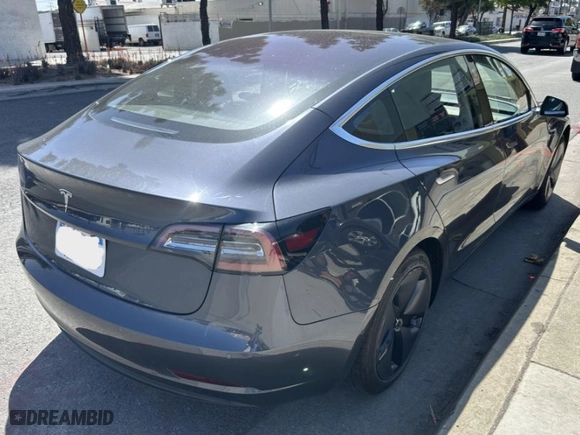 2018 Tesla Model 3 Long Range Battery with VIN 5YJ3E1EA8JF026497, listed as a IAAI auction lot 41987950 with 72,373 mi miles. Bid and sale history available at carsss.com. Image 4.