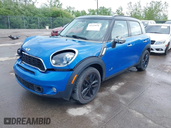 2014 MINI Countryman S with VIN WMWZC5C52EWP38659, listed as a IAAI auction lot 42229976 with 115,229 mi miles and . Bid and sale history available at DreamBid. Image 2.
