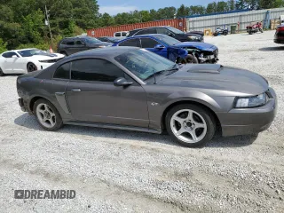 2003 Ford Mustang GT Deluxe with VIN 1FAFP42X13F392646, listed as a Copart auction lot 57938995 with 117,732 mi miles and Salvage title. Bid and sale history available at DreamBid. Image 4.