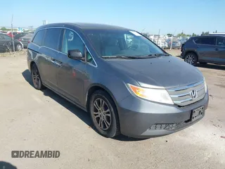 2012 Honda Odyssey EX-L with VIN 5FNRL5H6XCB061026, listed as a IAAI auction lot 42574612 with 144,480 mi miles and . Bid and sale history available at DreamBid. Image 1.