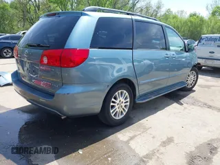 2009 Toyota Sienna XLE with VIN 5TDZK22C99S239755, listed as a IAAI auction lot 42096411 with 214,983 mi miles. Bid and sale history available at carsss.com. Image 4.