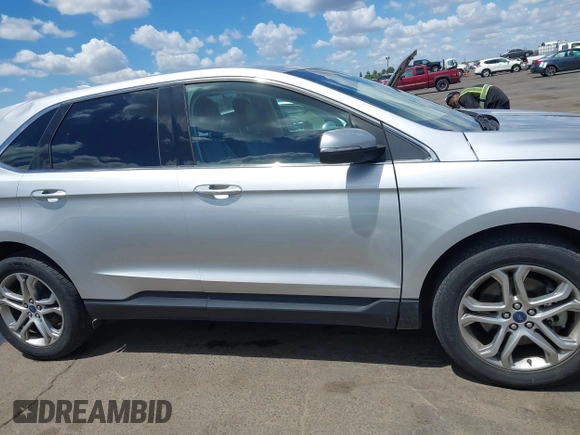 2015 Ford Edge Titanium z VIN 2FMTK4K95FBB47962, wystawiony jako IAAI lot #42234894 z przebiegiem Nie podano mil oraz . Historia ofert i sprzedaży dostępna na DreamBid. Obrazek 13.