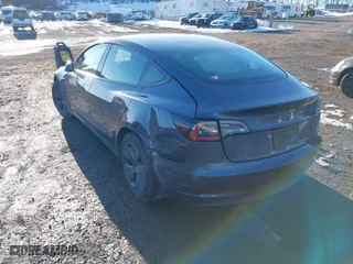 2023 Tesla Model 3 with VIN 5YJ3E1EA7PF509567, listed as a IAAI auction lot 41422396 with 28,914 mi miles. Bid and sale history available at carsss.com. Image 3.