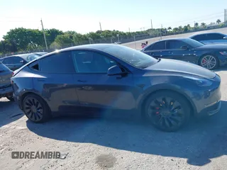 2022 Tesla Model Y Performance with VIN 7SAYGDEF6NF540094, listed as a IAAI auction lot 41786865 with 28,356 mi miles and . Bid and sale history available at DreamBid. Image 13.