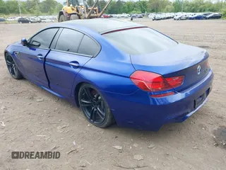 2014 BMW M6 z VIN WBS6C9C54EDV73943, wystawiony jako IAAI lot #42294944 z przebiegiem 129 823 mil mil oraz . Historia ofert i sprzedaży dostępna na DreamBid. Obrazek 3.