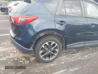 2016 Mazda CX-5 Grand Touring with VIN JM3KE2DYXG0890174, listed as a IAAI auction lot 42157884 with 141,873 mi miles. Bid and sale history available at carsss.com. Image 6.