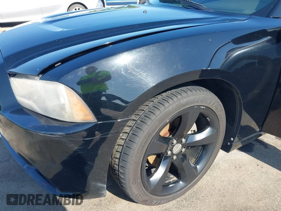 2012 Dodge Charger SXT with VIN 2C3CDXHG2CH258844, listed as a IAAI auction lot 42025908 with 214,529 mi miles. Bid and sale history available at carsss.com. Image 17.
