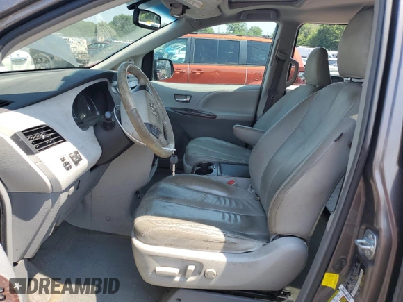 2012 Toyota Sienna XLE AAS with VIN 5TDYK3DC3CS237344, listed as a Copart auction lot 63271815 with 105,860 mi miles and Salvage title. Bid and sale history available at DreamBid. Image 7.